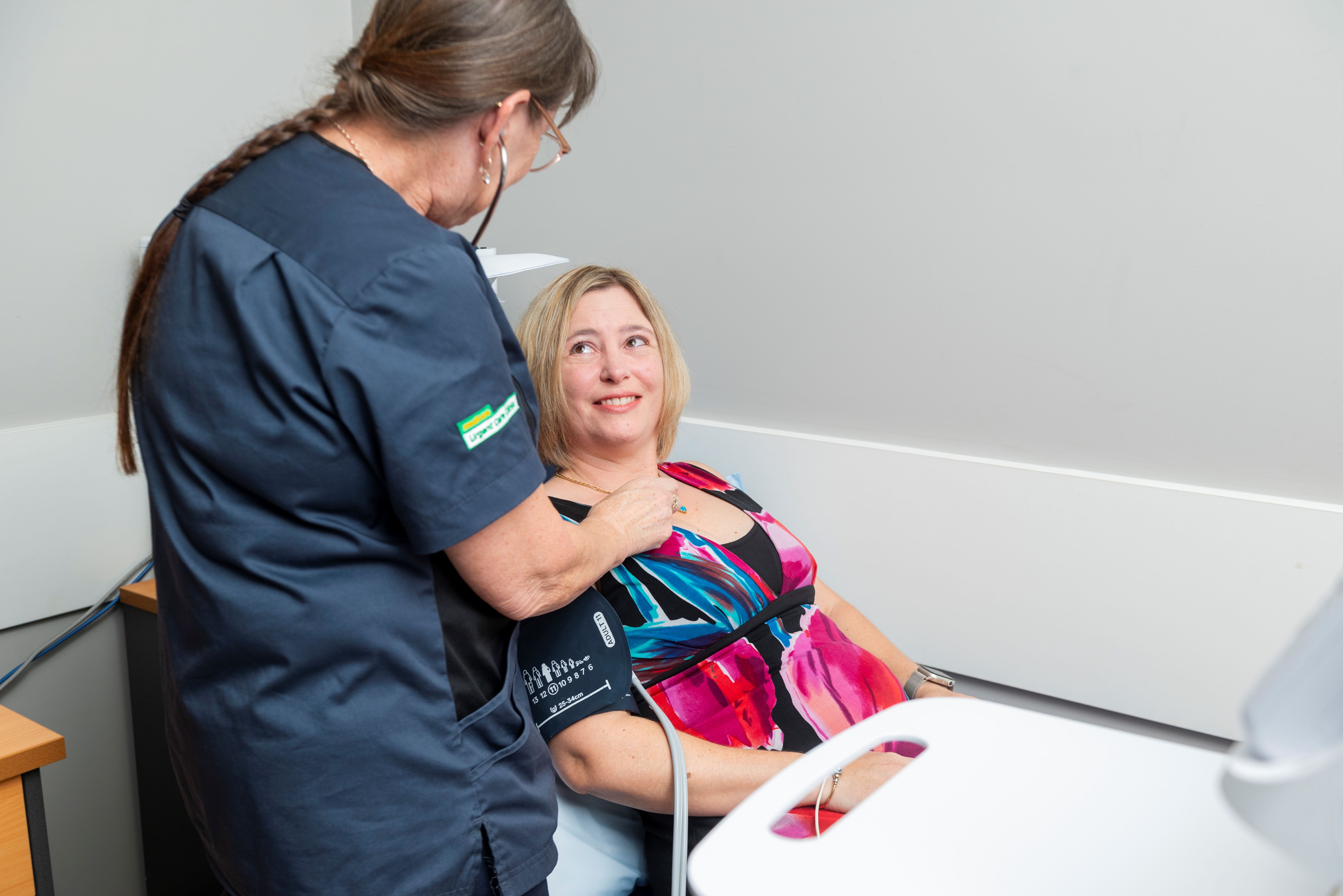 Registered Nurse Annette Sticklen attends to patient Fiona Peacock at the Cairns South Medicare UCC. 