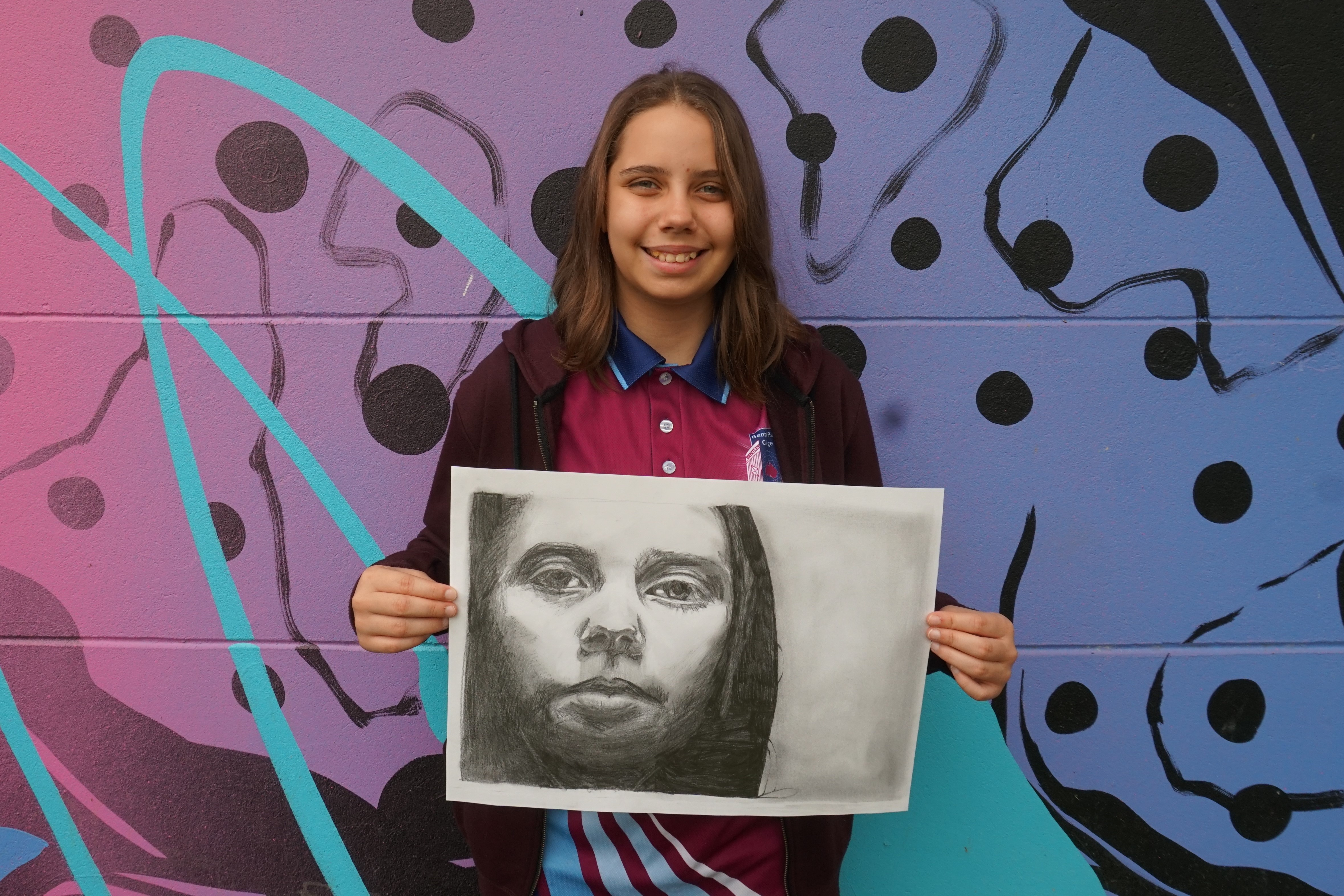 Naomi Sansness with her artwork