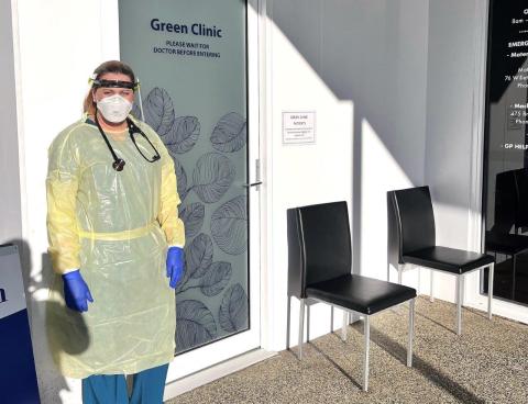 Doctor in front of clinic