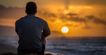 Mental health-silhouette young man on beach