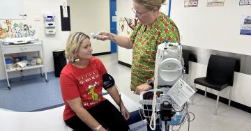 Nurse Andrea Mosbauer attends to Natalie Shand at the Cairns South Urgent Care Clinic, next to Balance! Edmonton Family Practice.