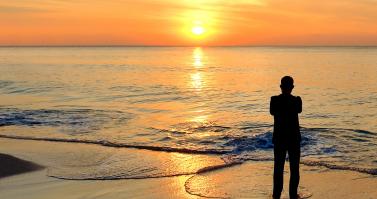 Mental health-silhouette man on beach